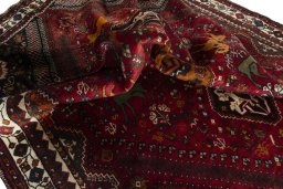 Corner detail of 2000s Shiraz rug showing border pattern and Wool pile