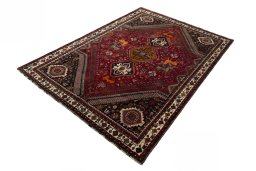 Corner detail of 2000s Shiraz rug showing border pattern and Wool pile