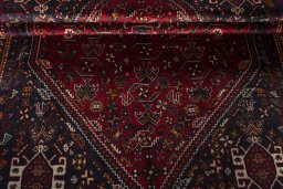 Corner detail of 2000s Shiraz rug showing border pattern and Wool pile