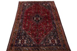 Surface texture of 2000s Shiraz rug with natural Wool and intricate pattern