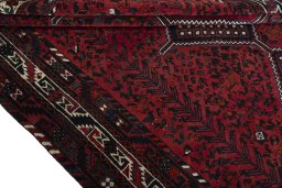 Corner detail of 2000s Shiraz rug showing border pattern and Wool pile