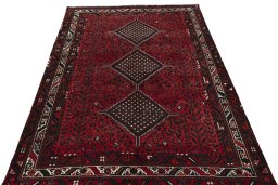 Surface texture of 2000s Shiraz rug with natural Wool and intricate pattern