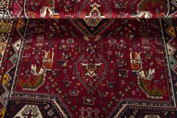 Corner detail of 2000s Shiraz rug showing border pattern and Wool pile