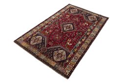 Corner detail of 2000s Shiraz rug showing border pattern and Wool pile