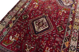 Backside of handmade 2000s Shiraz rug showing knot structure and weave density