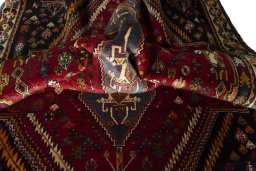 Corner detail of 2000s Shiraz rug showing border pattern and Wool pile