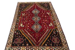 Surface texture of 2000s Shiraz rug with natural Wool and intricate pattern