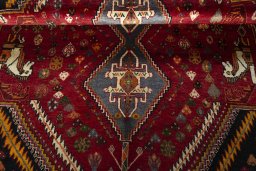 Full view of 2000s Shiraz rug from Iran / Persia, 267 × 185 cm in Red tones