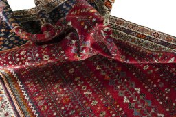 Corner detail of 2000s Shiraz rug showing border pattern and Wool pile