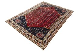 Corner detail of 2000s Shiraz rug showing border pattern and Wool pile