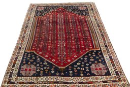 Surface texture of 2000s Shiraz rug with natural Wool and intricate pattern