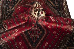 Corner detail of 2000s Shiraz rug showing border pattern and Wool pile