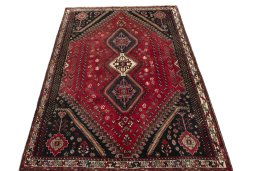 Surface texture of 2000s Shiraz rug with natural Wool and intricate pattern