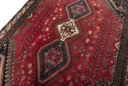 Backside of handmade 2000s Shiraz rug showing knot structure and weave density