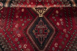 Full view of 2000s Shiraz rug from Iran / Persia, 273 × 181 cm in Red tones