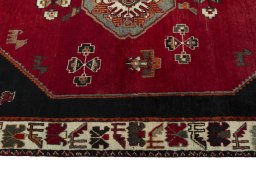 Corner detail of 2000s Shiraz rug showing border pattern and Wool pile