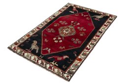 Corner detail of 2000s Shiraz rug showing border pattern and Wool pile
