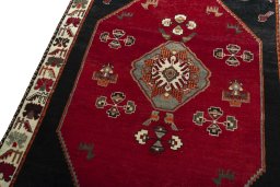 Backside of handmade 2000s Shiraz rug showing knot structure and weave density