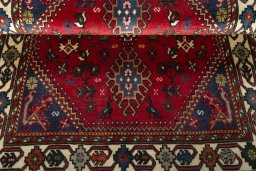 Corner detail of 2000s Shiraz rug showing border pattern and Wool pile