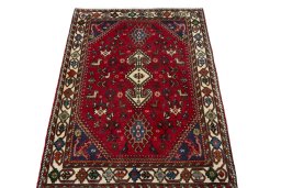 Surface texture of 2000s Shiraz rug with natural Wool and intricate pattern