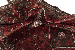Corner detail of 2000s Shiraz rug showing border pattern and Wool pile