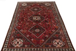 Surface texture of 2000s Shiraz rug with natural Wool and intricate pattern