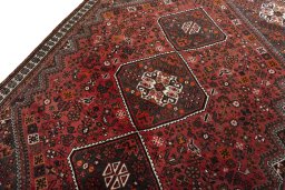 Backside of handmade 2000s Shiraz rug showing knot structure and weave density