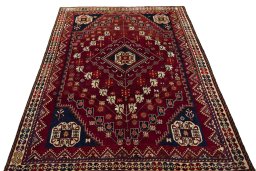 Surface texture of 2000s Shiraz rug with natural Wool and intricate pattern
