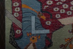 Backside of handmade 2000s Shiraz rug showing knot structure and weave density