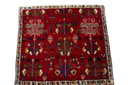Surface texture of 2000s Shiraz rug with natural Wool and intricate pattern