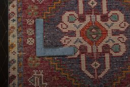 Backside of handmade 2000s Shiraz rug showing knot structure and weave density