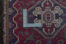 Backside of handmade 2000s Shiraz rug showing knot structure and weave density