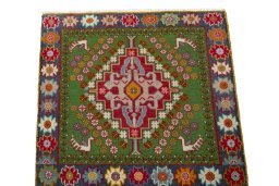 Surface texture of 2000s Shiraz rug with natural Wool and intricate pattern