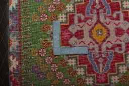Backside of handmade 2000s Shiraz rug showing knot structure and weave density