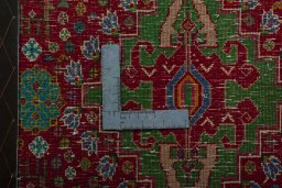Backside of handmade 2000s Shiraz rug showing knot structure and weave density