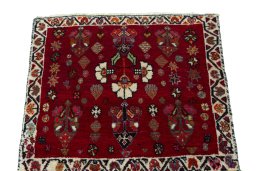 Surface texture of 2000s Shiraz rug with natural Wool and intricate pattern