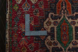 Backside of handmade 2000s Shiraz rug showing knot structure and weave density