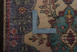 Backside of handmade 2000s Shiraz rug showing knot structure and weave density