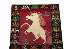 Surface texture of 2000s Shiraz rug with natural Wool and intricate pattern