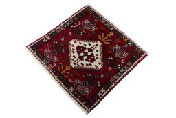 Corner detail of 2000s Shiraz rug showing border pattern and Wool pile