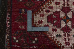 Backside of handmade 2000s Shiraz rug showing knot structure and weave density