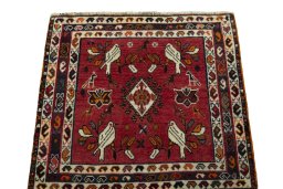 Surface texture of 2000s Shiraz rug with natural Wool and intricate pattern