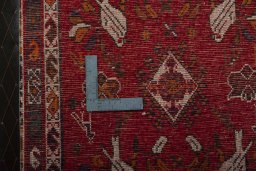 Backside of handmade 2000s Shiraz rug showing knot structure and weave density