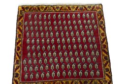 Surface texture of 2000s Shiraz rug with natural Wool and intricate pattern