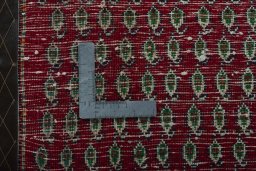 Backside of handmade 2000s Shiraz rug showing knot structure and weave density