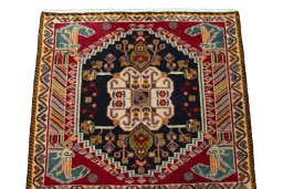 Surface texture of 2000s Shiraz rug with natural Wool and intricate pattern