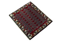 Corner detail of 2000s Shiraz rug showing border pattern and Wool pile