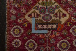 Backside of handmade 2000s Shiraz rug showing knot structure and weave density