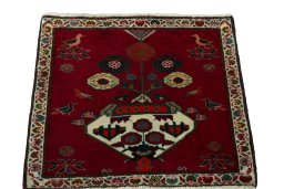 Surface texture of 2000s Shiraz rug with natural Wool and intricate pattern