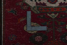 Backside of handmade 2000s Shiraz rug showing knot structure and weave density